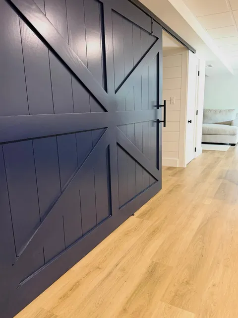 Bold - Functional and built to make a statement.

This custom navy barn door added character, privacy, and architectural interest all in one. From the clean lines to the oversized hardware, every detail was designed to elevate this basement renovation while maximizing usable space.

A perfect example of how custom millwork can transform an ordinary opening into a standout feature ⚓️