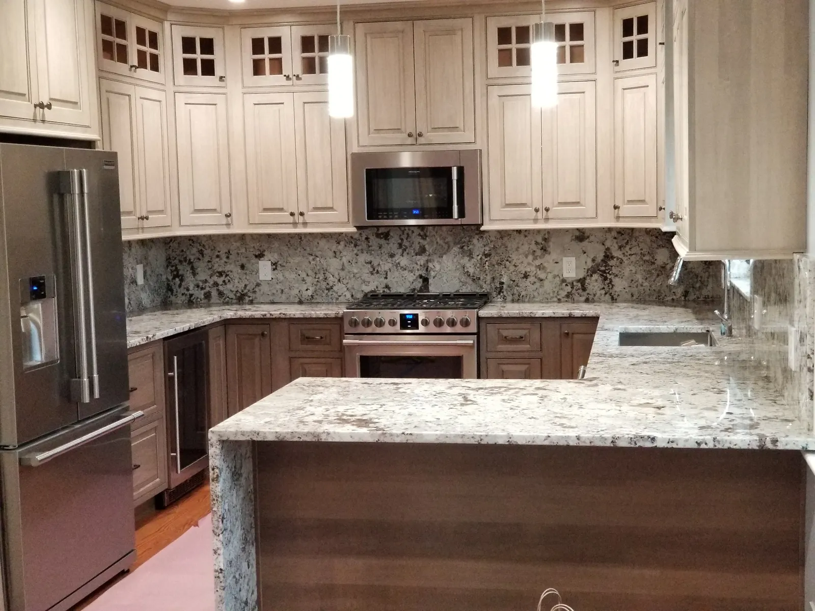 Renovated kitchen with pendant lighting and appliance wiring