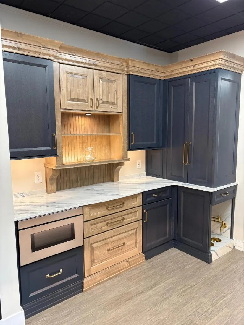 Dekton Trance white kitchen countertop with wood and black cabinetry