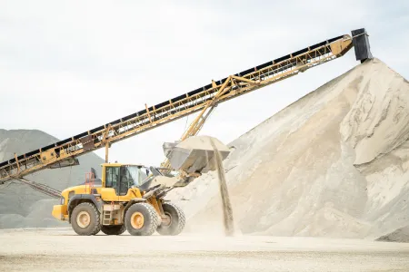 Excavator On Lifting Asphalt Aggregates