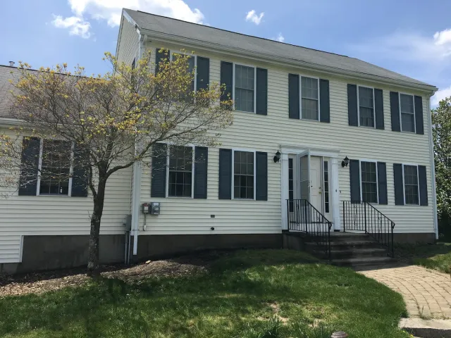 Freshly pressure-washed colonial home exterior in Worcester County, MA — Pro Pressure Washing