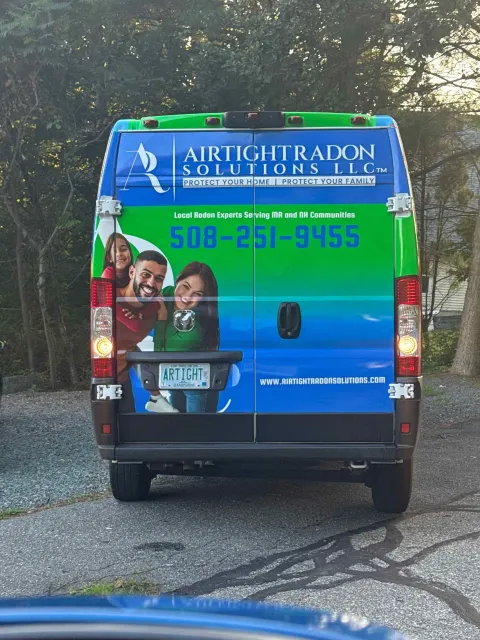 Back of a company van with a bright design,