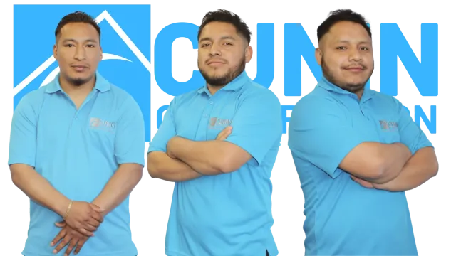 Three men in light blue polo shirts pose with arms crossed against a blue background with partial text visible