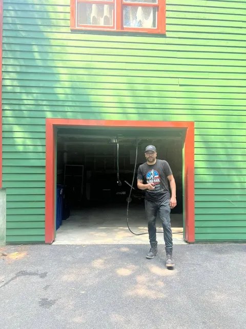 Alpha Haul crew member outside a cleared garage
