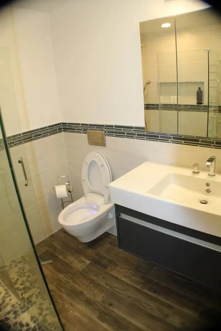 Remodeled bathroom with wall-hung fixtures