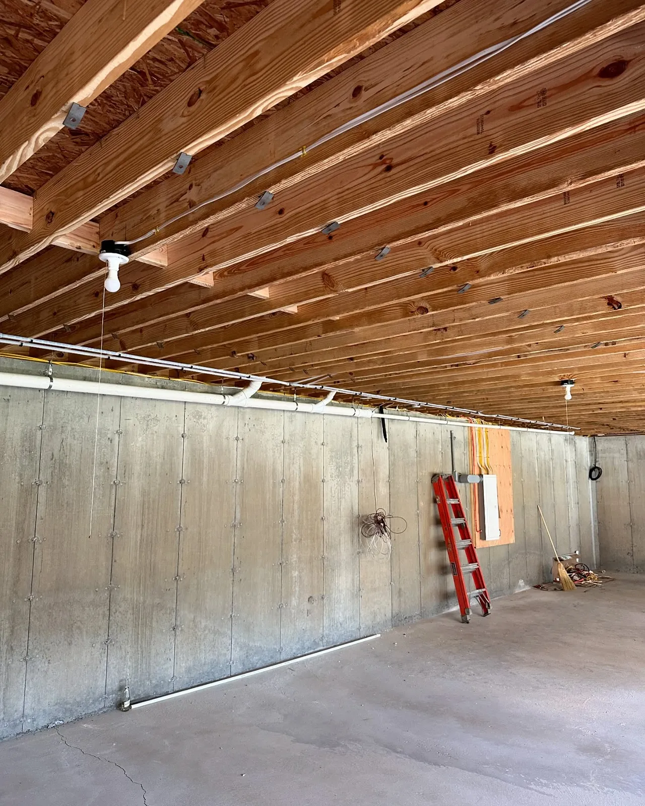New construction plumbing rough-in with exposed framing and piping by Top Tier Plumbing & Heating LLC