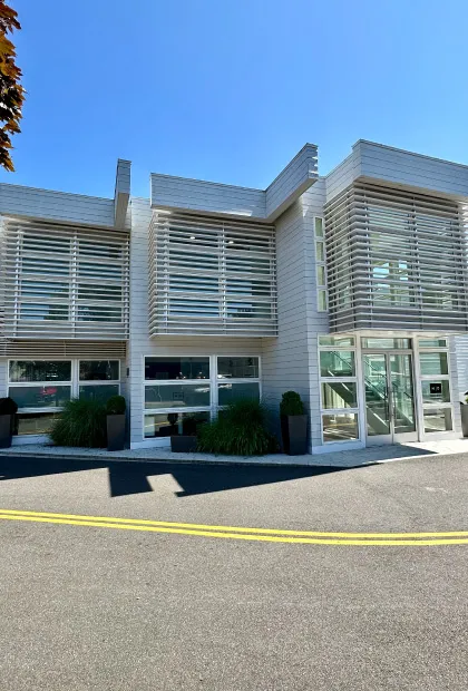 A building with many windows and doors on the outside.