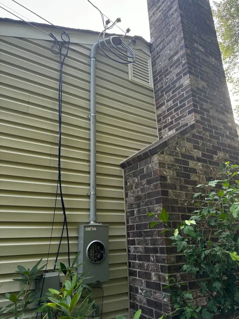 Electrical Meter Box and Wiring Installation on the Exterior of a House