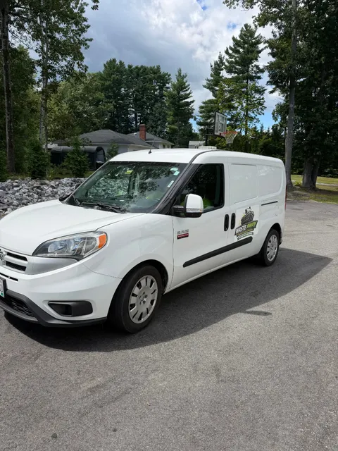 Waste Away work van parked at a Southern Maine job site