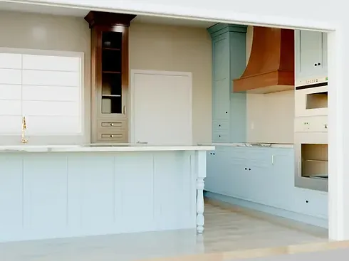Pioneer cabinet design rendering showing a two-tone kitchen with an island and wood hood.