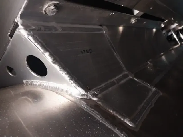 Close-up of precision aluminum weld repair showcasing clean, strong welds by Warrior Welding LLC