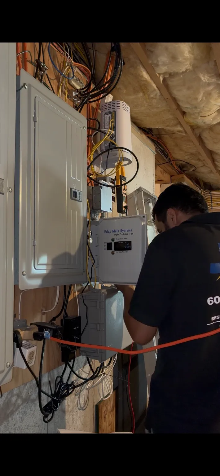JG Electric troubleshooting an ice melt heat cable system in Southern New Hampshire
