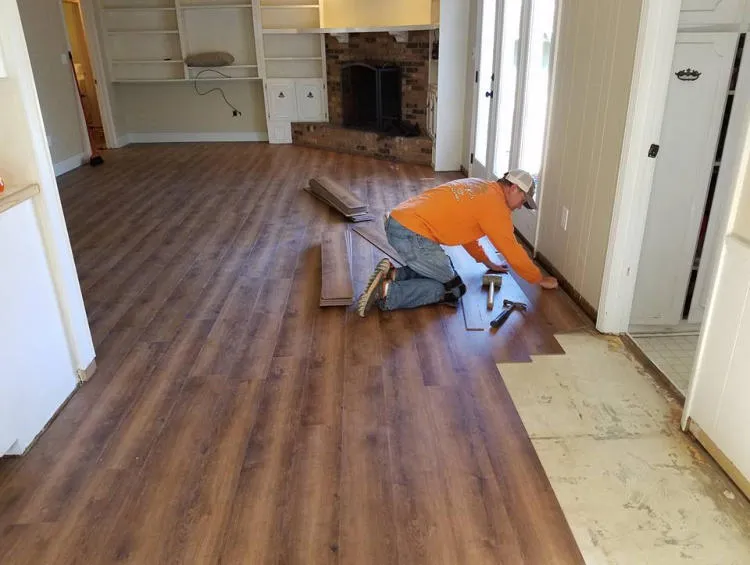 Installing plank flooring during a room remodel