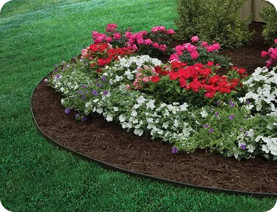Project idea: curved planting bed with colorful flowers and mulch