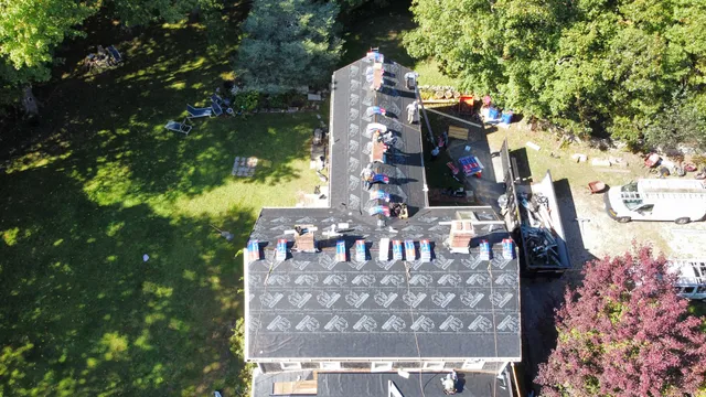Underlayment being installed on roof