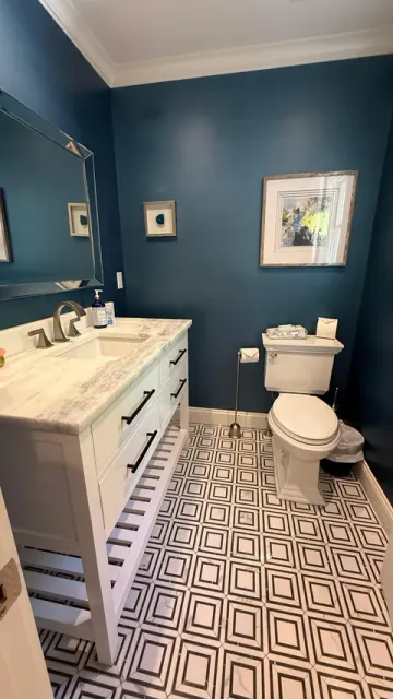 A sanitised bathroom with a cleaned sink and mirror