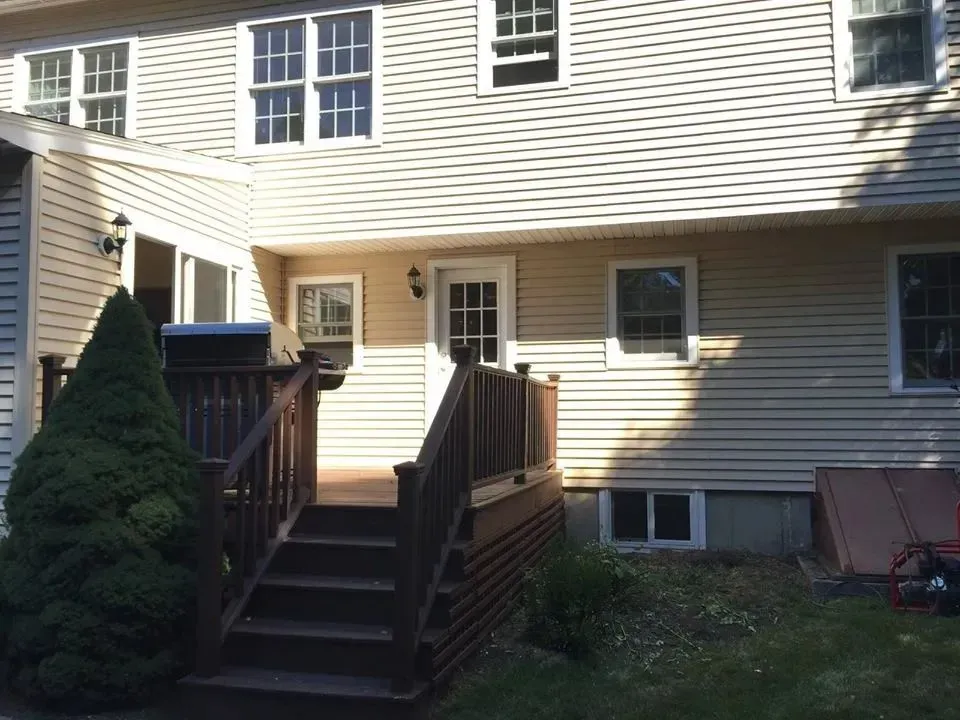 Rear elevation before deck and addition work