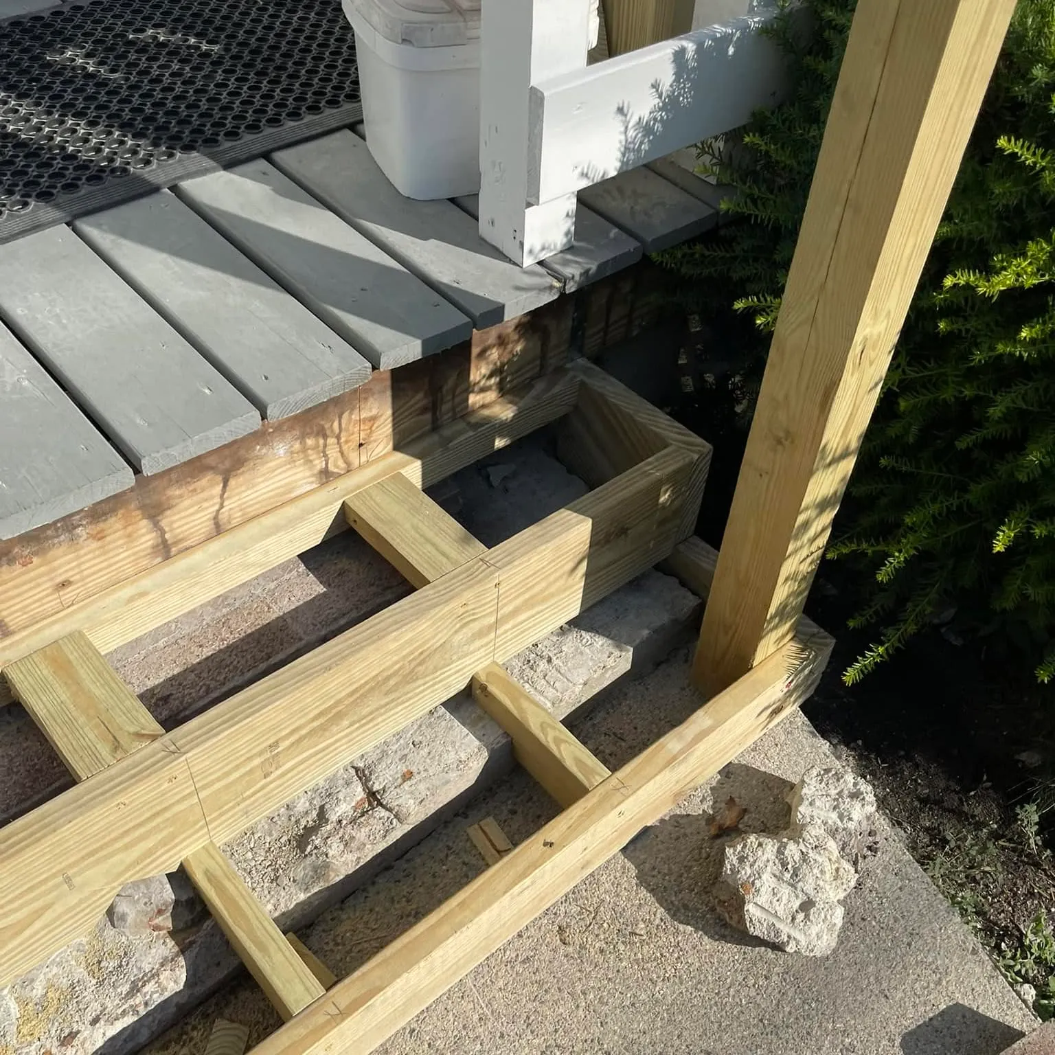 New pressure-treated stair stringers and treads