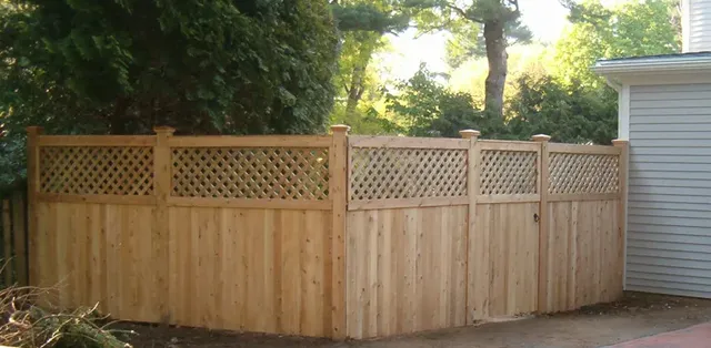 Lattice-top cedar fence at a property corner
