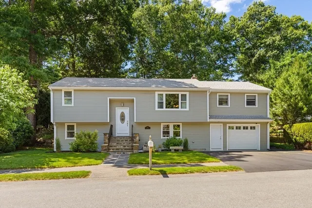 Well-maintained split-entry home located in one of Lynn’s most desirable Ward 1 neighborhoods, just moments from Lynn Woods Reservation. This move-in ready property offers 4 bedrooms, 2 full bathrooms, 8 total rooms with a flexible and functional layout. The main level features a bright kitchen with stainless steel appliances, ample counter space, and an adjoining dining area that flows into a comfortable living room. A screened-in porch off the kitchen/dining area provides the perfect space for relaxing or entertaining while overlooking the backyard. Two well-sized bedrooms and a full bath complete the upper level. The lower level provides two additional bedrooms, a spacious family room, and direct access to the garage. Enjoy outdoor living in the beautifully manicured, fully fenced backyard, perfect for entertaining or relaxing. The home also offers strong curb appeal and convenient access to major highways, Route 1, as well as nearby restaurants, shopping, and everyday amenities.