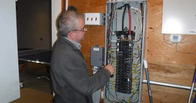 electrical inspector, inspecting a fuse box