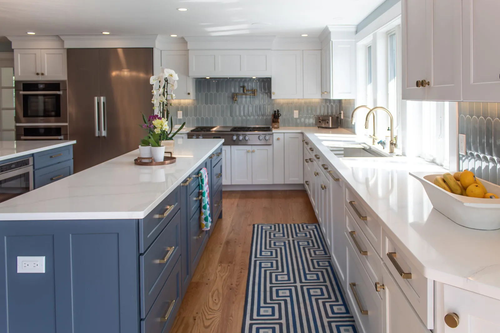 Blue and white kitchen with long island