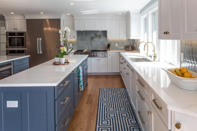 Blue and white kitchen with long island