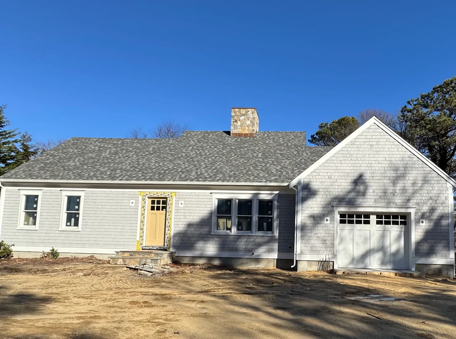 New shingled Cape under construction, ready for final grading