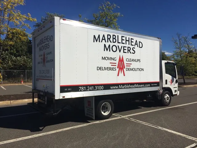 Box truck with company phone and website