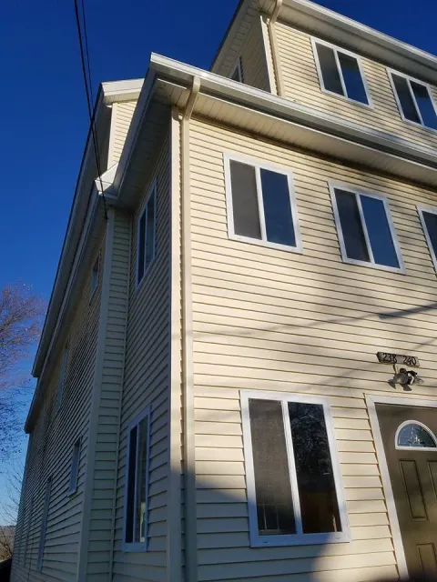 Seamless gutters on two-story home