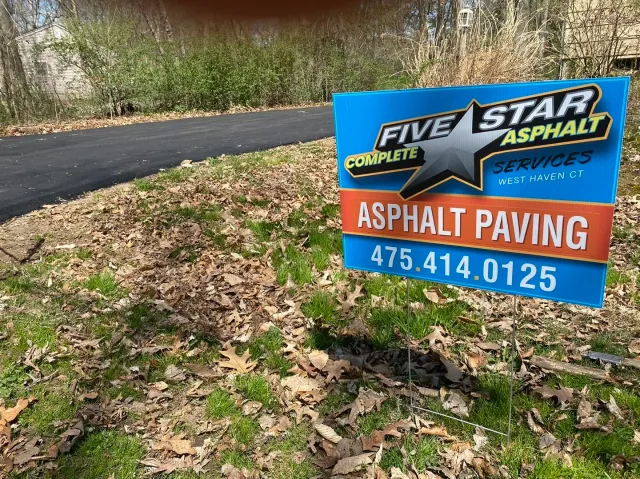 A finished driveway with fresh asphalt pavement in Guilford Connecticut