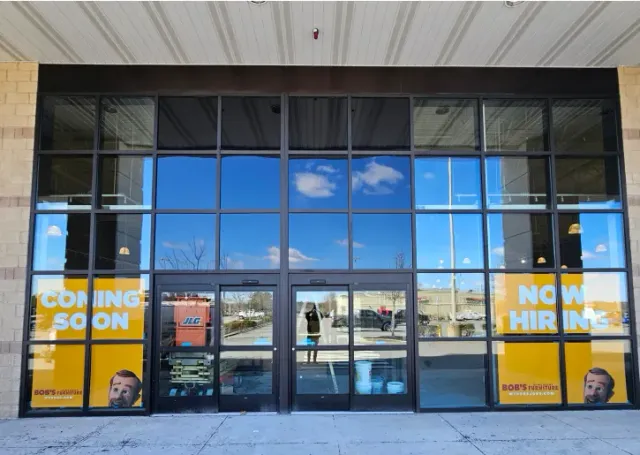 Storefront with large glass windows and doors;