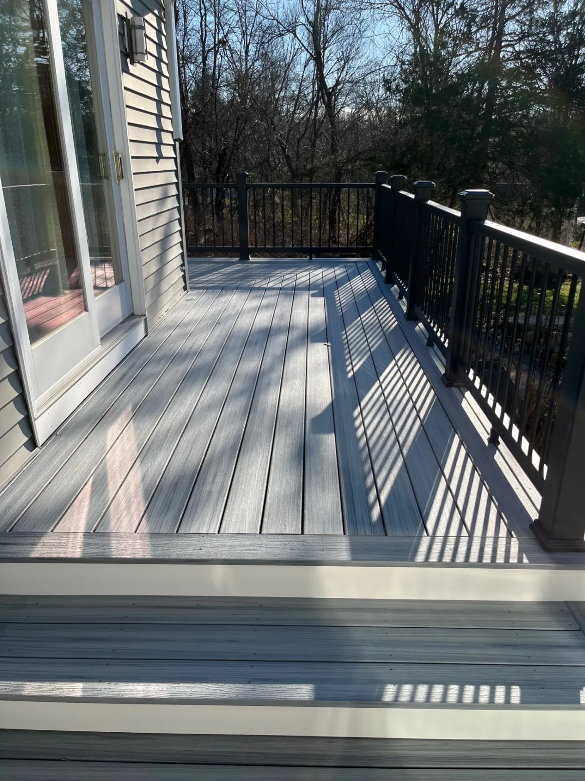 residential-decking-with-black-metal-railing-in-needham-ma