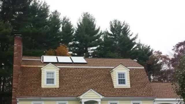 A house with a solar panel on the roof