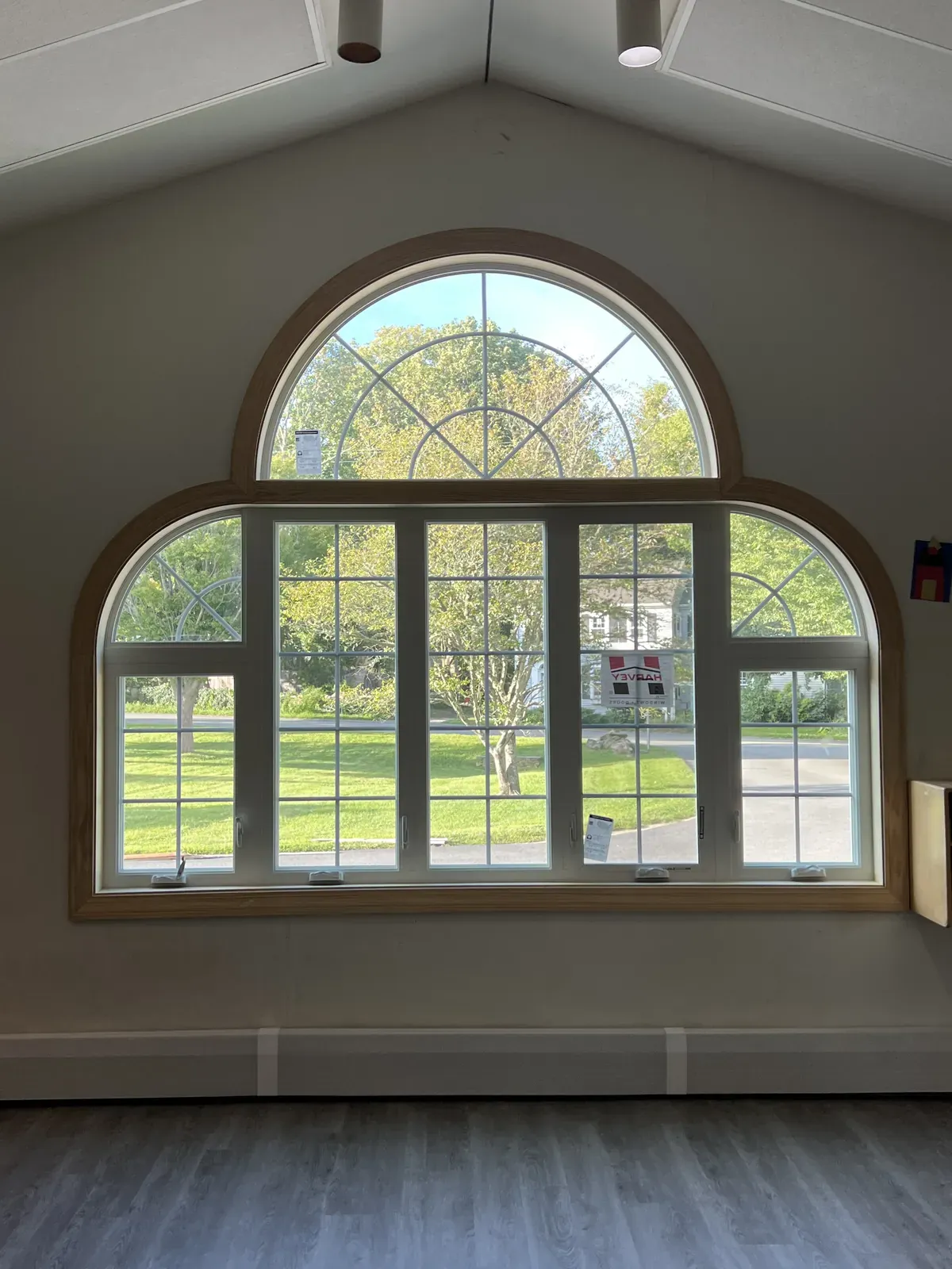 Interior arched palladian window overlooking a lawn