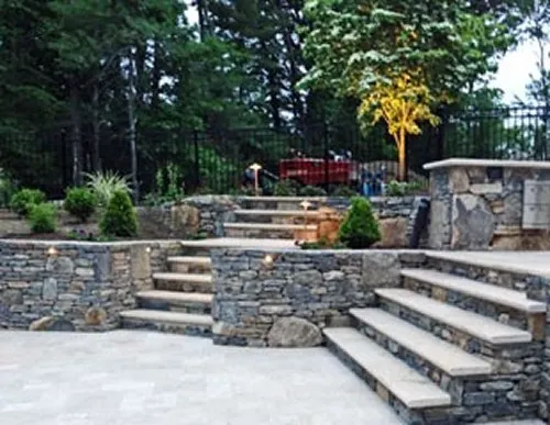 Sunken Travertine Patio& Stone Steps by New View