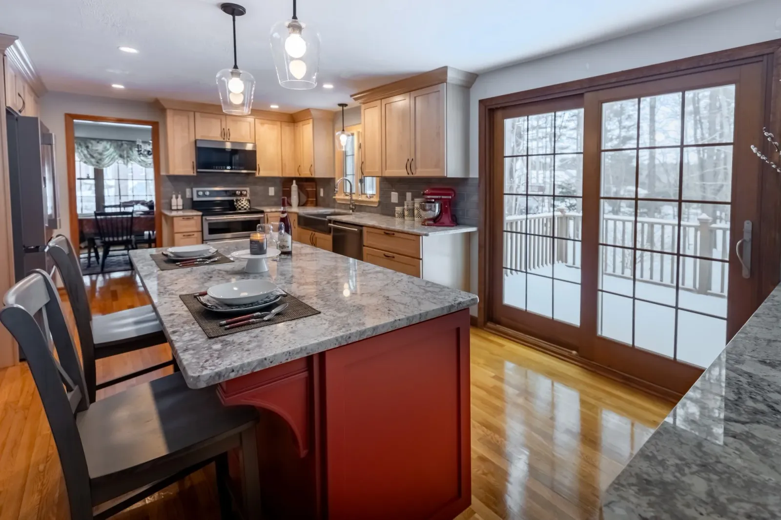 Natural Maple Cabinetry and Red Delicious Statement Island.