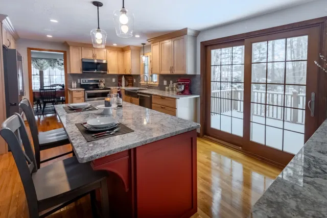 Natural Maple Cabinetry and Red Delicious Statement Island.