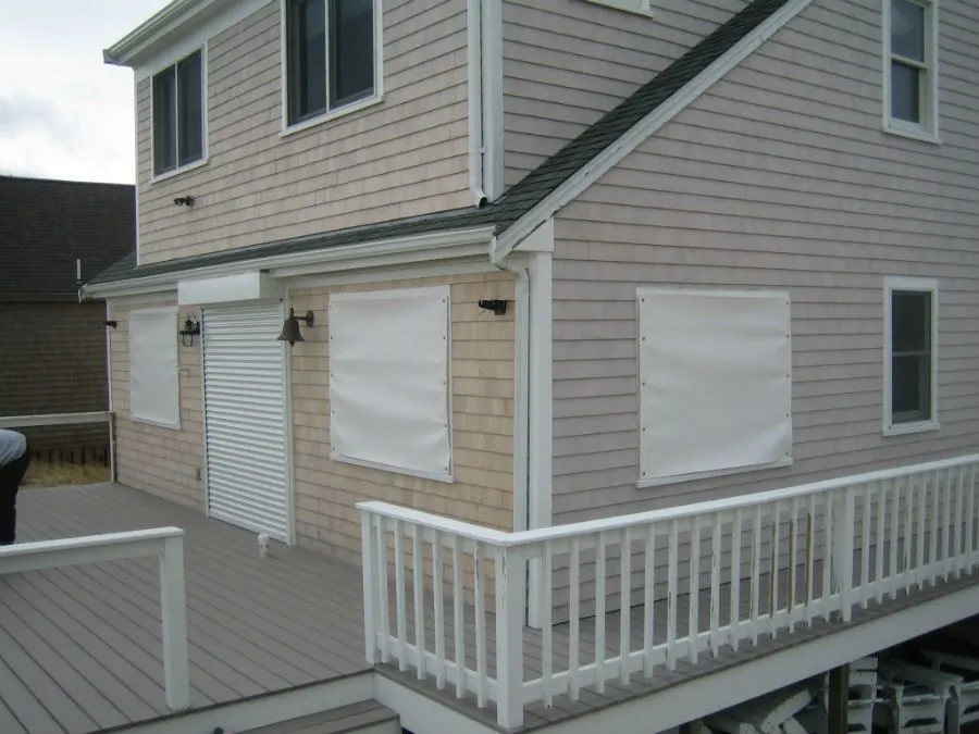 A house with white shutters and a porch.