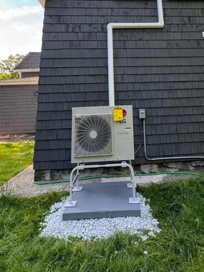 Neat electrical and line set connectivity for an outdoor heat pump unit