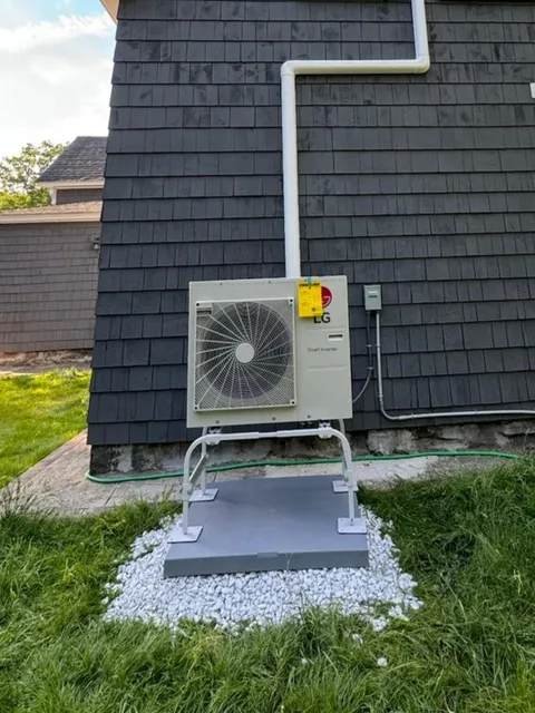 Neat electrical and line set connectivity for an outdoor heat pump unit