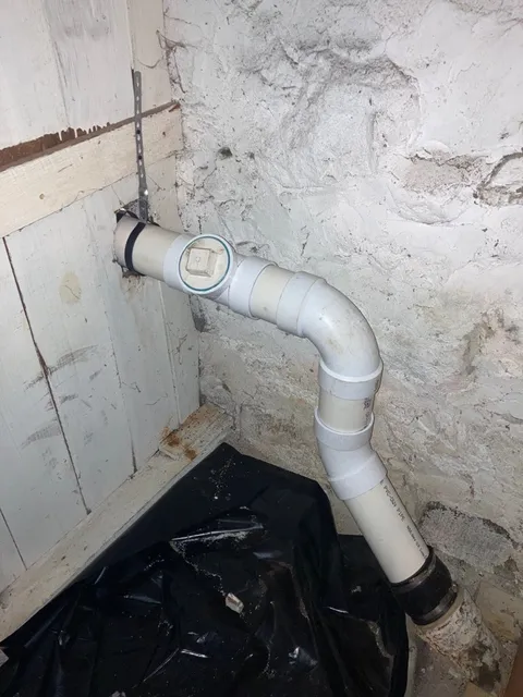 PVC drain pipe repair in Rhode Island basement