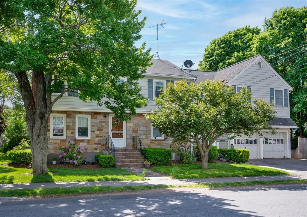Great location! This classic Garrison Colonial sits on a desirable corner lot and features a cozy fireplace living room, hardwood floors, and an eat-in kitchen. The main level also offers a deck, formal dining room, and a flexible first-floor bedroom or home office. Upstairs you will find four generously sized bedrooms and a tiled full bath. Additional highlights include a partially finished basement, updated windows, central A/C, and a fenced, private yard. An attached two-car garage is topped by a full in-law apartment with its own kitchen/living room, hardwood floors, two bedrooms, and a full bath. All this just a short walk to Andrews Park and conveniently close to East Milton Square, restaurants, and highway access.
