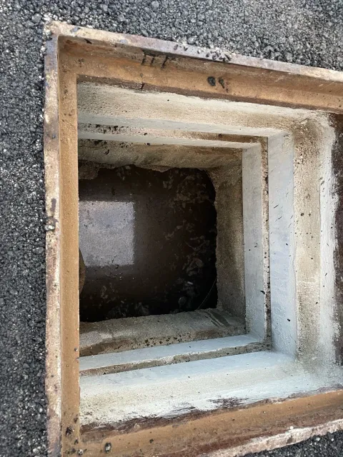 There is a hole in the wall that looks like a window.