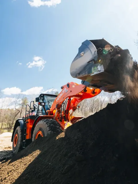 Price Landscape and Construction loader loading dirt