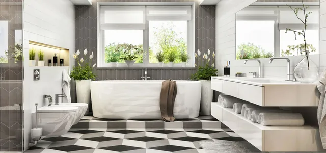 Bright, airy bathroom remodel in an NH home featuring a freestanding soaking tub, sleek double vanity, patterned tile flooring, and abundant natural light.