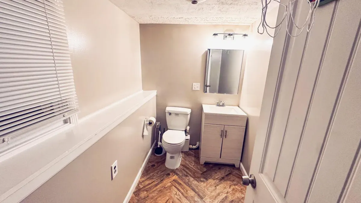 Bathroom painting service showing freshly painted walls and trim in a Waltham, MA home