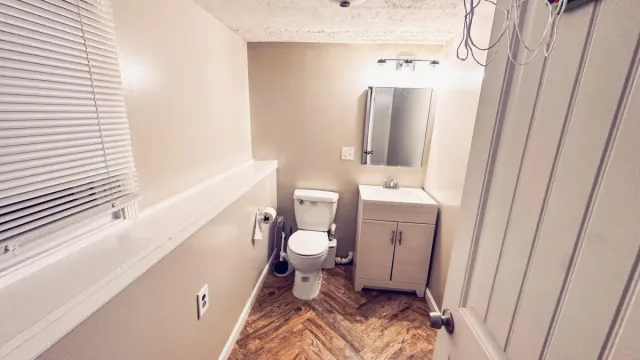 Bathroom painting service showing freshly painted walls and trim in a Waltham, MA home