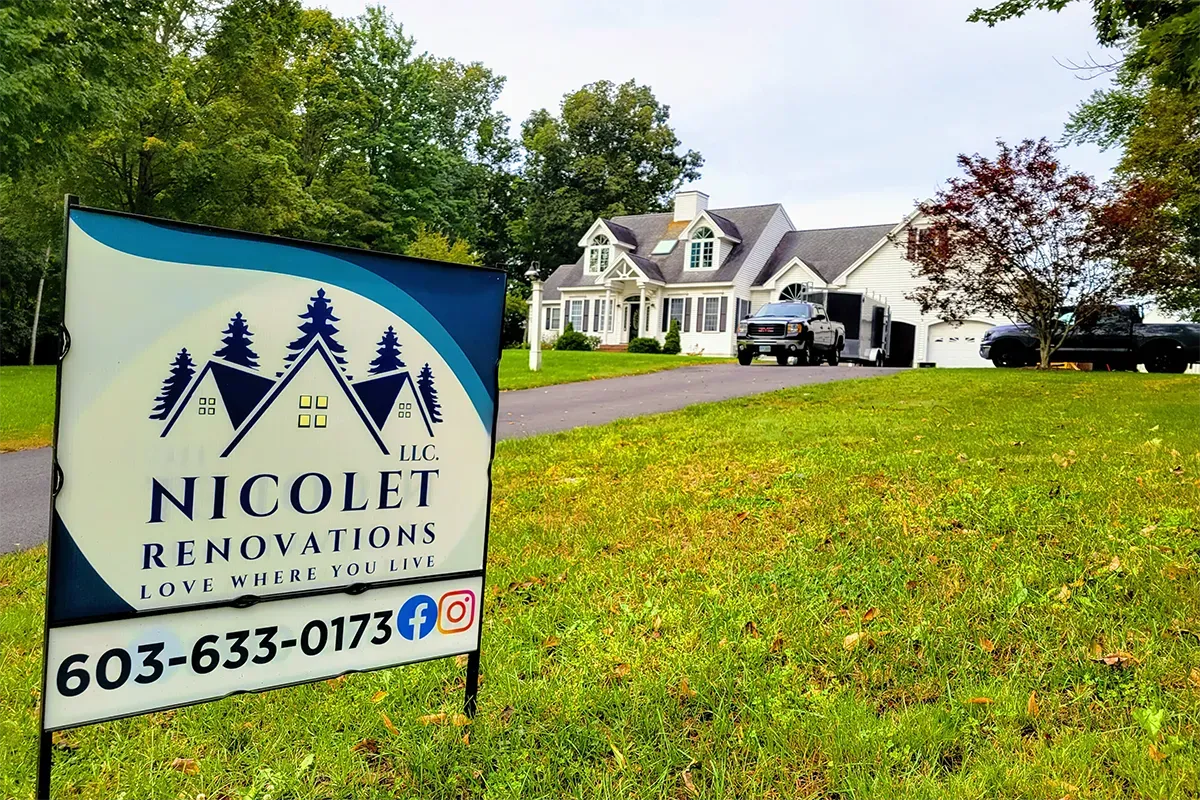 Exterior renovations underway on an entire home, with a contractor sign in the yard showing a remodeling project aimed at creating more space and improving the floor plan.
