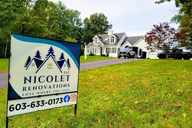 Exterior renovations underway on an entire home, with a contractor sign in the yard showing a remodeling project aimed at creating more space and improving the floor plan.